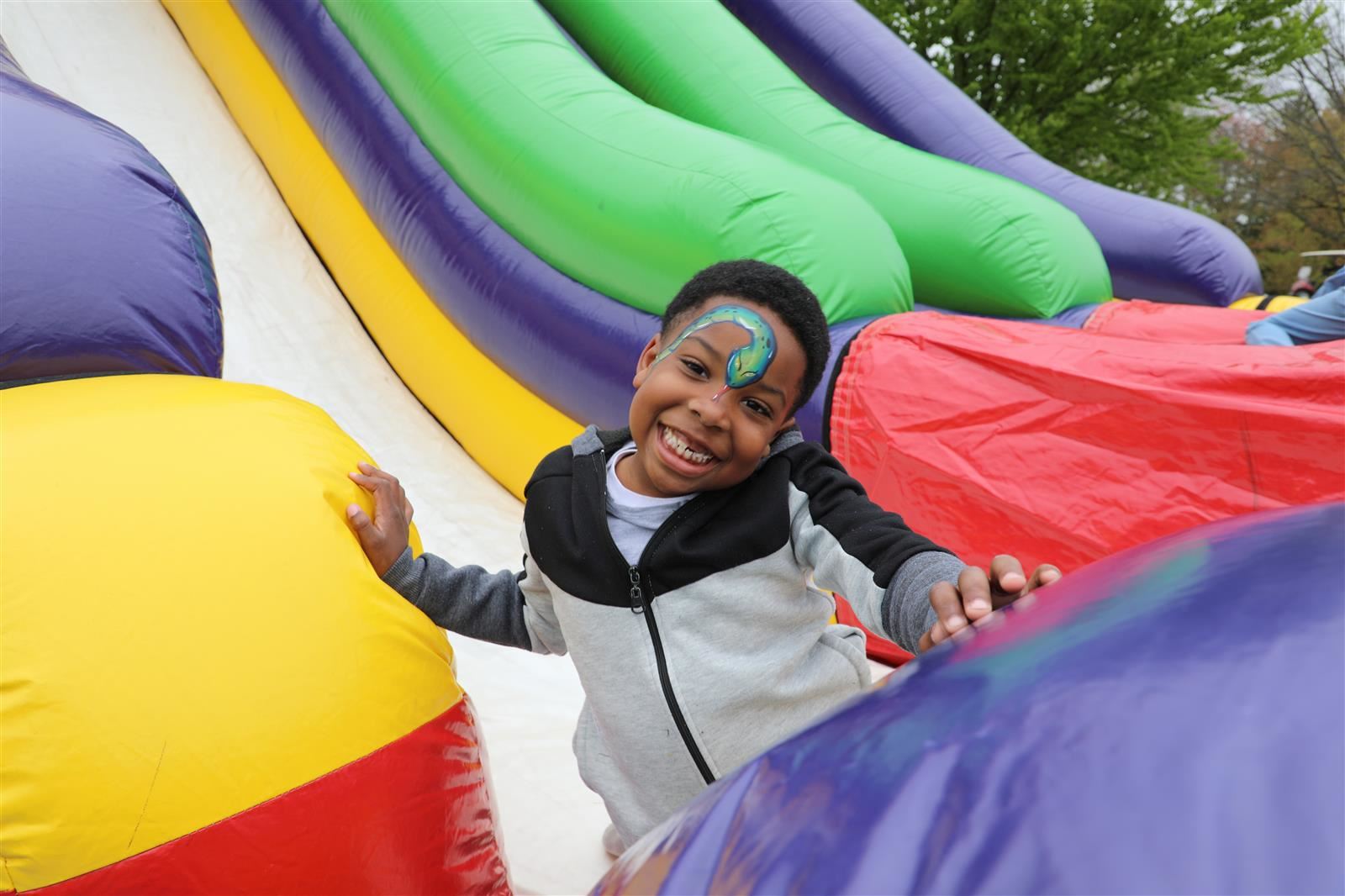 child playing on slide